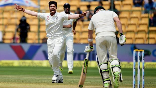 Umesh Yadav celebrates the wicket of Steve Smith on day 4 of the second India vs Australia Test in Bangalore on Tuesday.(PTI)