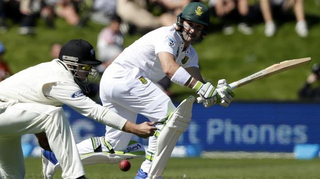 South Africa's Dean Elgar watches the ball as New Zealand's Tom Latham attempts to catch it during the first cricket Test match.(AP)