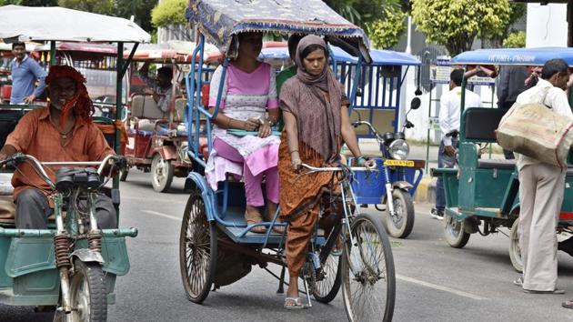 ‘Pulling along’ in a man’s world: Ranju Devi, mother of three, holds her own in a profession almost completely dominated by men. Ranju became a cycle rickshaw puller in order to supplement her family income. (Sanjeev Verma/HT Photo)