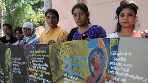 Students display placards at an exhibition on International Women's Day, in Patna . (AP Dube/HT Photo) Students display placards at an exhibition on International Women's Day, in Patna . (AP Dube/HT Photo)