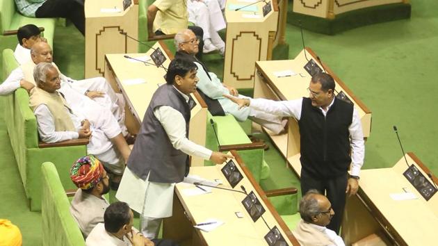 Leader of opposition Rameshwar Dudi restains partyman Govind Dotasara from interrupting the CM during her speech. (Himanshu Vyas/HT Photo) Leader of opposition Rameshwar Dudi restains partyman Govind Dotasara from interrupting the CM during her speech. (Himanshu Vyas/HT Photo)