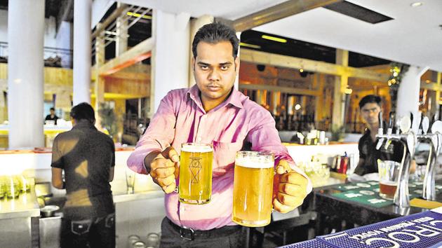 A bartender serves beer at a brewery in Star Mall. Brewery owners say the move will encourage fresh beer drinkers to turn to hard liquor, hitting the retail beer trade. (Parveen Kumar/HT Photo) A bartender serves beer at a brewery in Star Mall. Brewery owners say the move will encourage fresh beer drinkers to turn to hard liquor, hitting the retail beer trade. (Parveen Kumar/HT Photo)