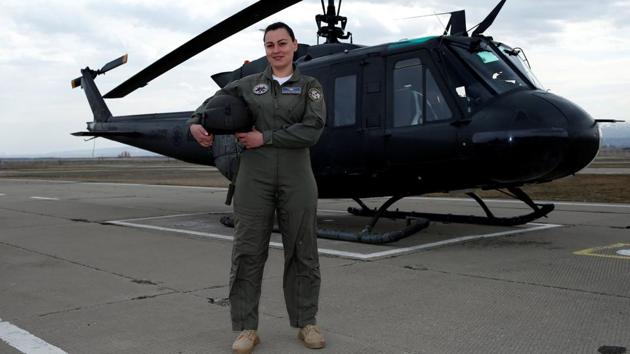 Ekaterine Kvlividze, 30, a military pilot captain, poses for a photograph in front of a Georgian Air Force UH-1H helicopter in Tbilisi, Georgia, February 22, 2017. Kvlividze joined the Georgian Air Forces in 2007. ‘There were some difficulties at the beginning, I felt some irony, cynicism. I felt they did not appreciate me. But, thank God, during the last 10 years society has changed and nowadays a woman pilot is a normal thing.’ (David Mdzinarishvili / REUTERS)