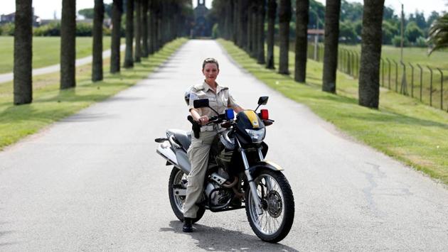 Ana Maria del Verdun Suarez, 27, a police officer, poses for a photograph in the outskirts of Montevideo City, Uruguay, February 23, 2017. ‘More women should be able to have jobs that traditionally were considered only for men. I believe that discrimination comes sometimes from all of us, it comes from the inside. There are already many professions that were exclusively male and are now performed by women,’ Suarez said. (Andres Stapff / REUTERS)