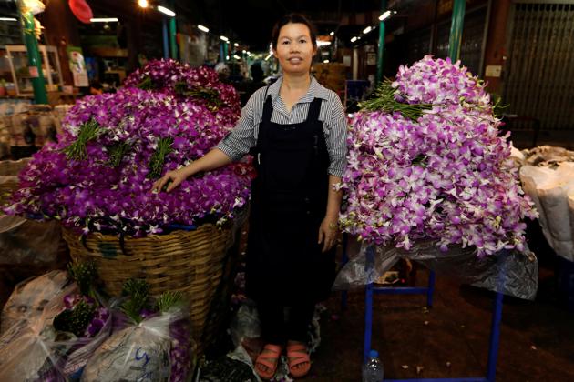 Ram, 46, poses for a photograph at her stall at the flower market in Bangkok, Thailand, February 26, 2017. ‘In this market men do the hard jobs, they carry heavy things, load trucks,’said Ram. (Jorge Silva / REUTERS)