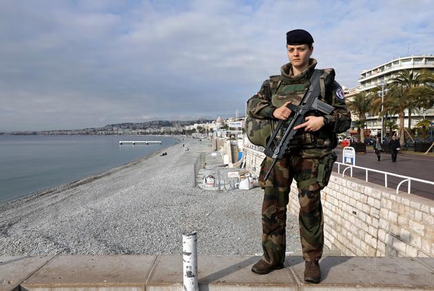 Merylee, 26, a soldier, poses for a photograph in Nice, France, February 23, 2017. ‘The parity in the army already exists, it is the uniform that takes precedence over gender,’ Merylee said. (Eric Gaillard / REUTERS)