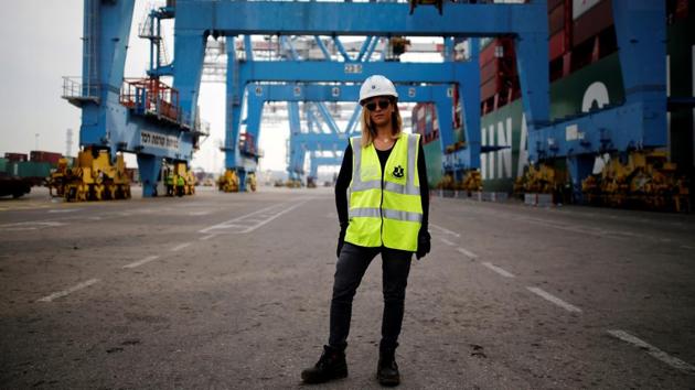 Liz Azoulay, 26, who loads and unloads cargo at Ashdod port, poses for a photograph at the port, in Ashdod, southern Israel, February 22, 2017. ‘In most of my professional life I did not face any inequality. In the port of Ashdod we are equal on the docks. I am the first woman who began working at the Ashdod port as a stevedore.’ (Amir Cohen / REUTERS)