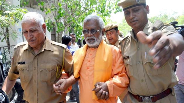 Swami Aseemanand being produced at a court.(HT File Photo)