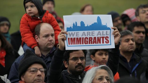 People listen during a vigil in Washington in honour of Srinivas Kuchibhotla, an Indian engineer who was shot and killed in Kansas. (REUTERS) People listen during a vigil in Washington in honour of Srinivas Kuchibhotla, an Indian engineer who was shot and killed in Kansas. (REUTERS)