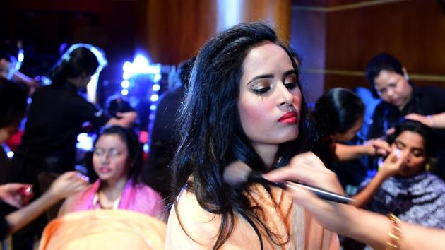 A Bangladeshi acid attack survivor getting ready for the fashion show . (AFP)