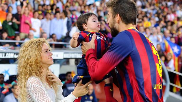 Shakira and Gerard Pique of FC Barcelona are seen with their son Milan in this September 2013 file picture.(Getty Images)