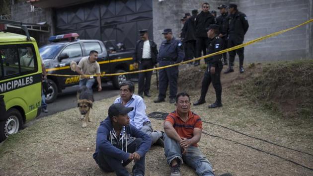 Relatives wait outside the Virgen de la Asunción children's shelter, in San Jose Pinula, Guatemala, on Wednesday. (AP Photo) Relatives wait outside the Virgen de la Asunción children's shelter, in San Jose Pinula, Guatemala, on Wednesday. (AP Photo)