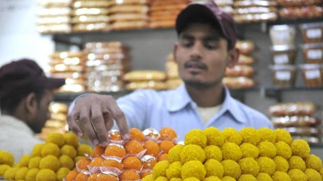 Owners of some sweetmeat shops in the city have their hands full as they are receiving orders in bulk for ‘motichoor laddoos’ and other sweets from leaders of different political parties.(Gurminder Singh/HT Photo)