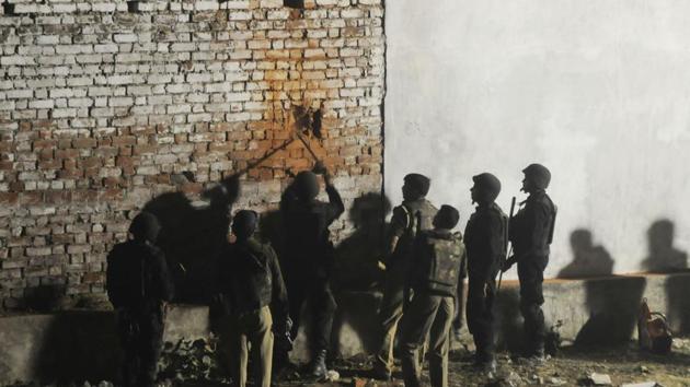 Uttar Pradesh anti-terror squad members make hole in the wall of the house where Saifullah, a terror suspect, was hiding in the Thakurganj area of Lucknow on Tuesday. (Deepak Gupta) Uttar Pradesh anti-terror squad members make hole in the wall of the house where Saifullah, a terror suspect, was hiding in the Thakurganj area of Lucknow on Tuesday. (Deepak Gupta)