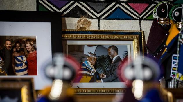 A framed photograph  shows Mahlangu shaking hands with former South African president Thabo Mbeki. (GULSHAN KHAN / AFP) 
