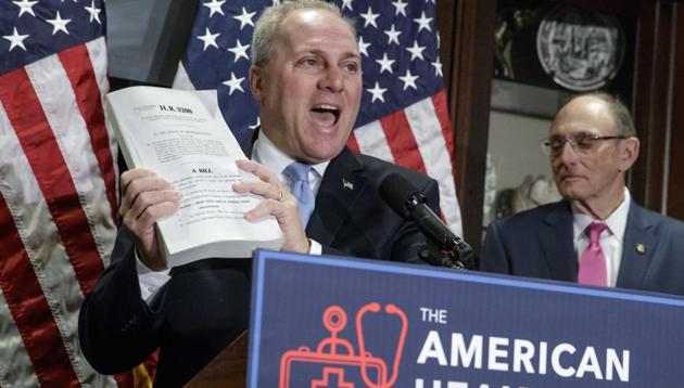House majority whip Steve Scalise (left) holds up a copy of the original Affordable Care Act bill during a news conference in Washington. (AP) House majority whip Steve Scalise (left) holds up a copy of the original Affordable Care Act bill during a news conference in Washington. (AP)