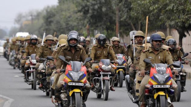 Noida Police during a bike rally on the eve of counting day of UP elections in Noida. (Sunil Ghosh/ht photo)