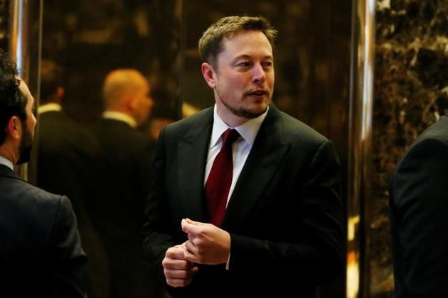 Tesla Chief Executive, Elon Musk enters the lobby of Trump Tower in Manhattan, New York.