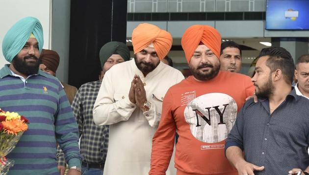 Congress candidate and party’s star campaigner Navjot Singh Sidhu arrives at Amritsar Airport on Friday.(Gurpreet Singh/HT Photo)