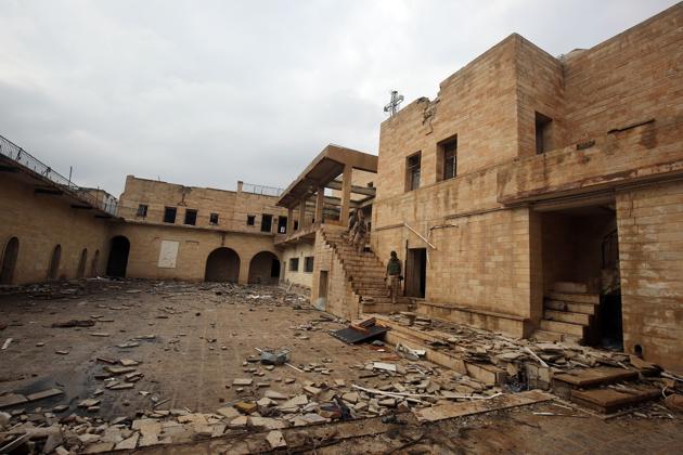 Iraqi soldiers inspect the debris at St. George's Monastery, a historical Chaldean Catholic church on the outskirts of Mosul, which was destroyed by the Islamic State. (AFP) Iraqi soldiers inspect the debris at St. George's Monastery, a historical Chaldean Catholic church on the outskirts of Mosul, which was destroyed by the Islamic State. (AFP)