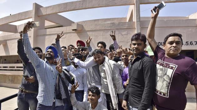 Workers at Maruti’s Manesar factory celebrate after being acquitted in the case on Friday.(Sanjeev Verma/HT PHOTO)