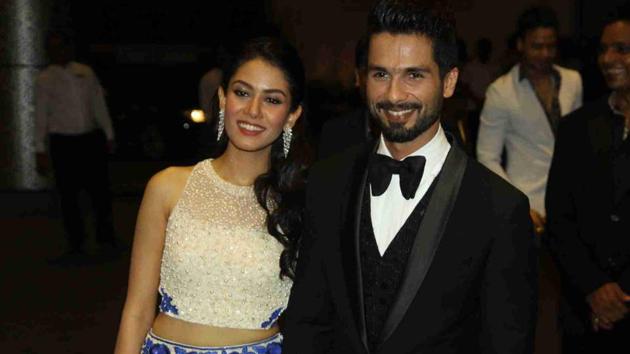 Actor Shahid Kapoor with his wife Mira Rajput during their wedding reception in Mumbai in 2015.(IANS)