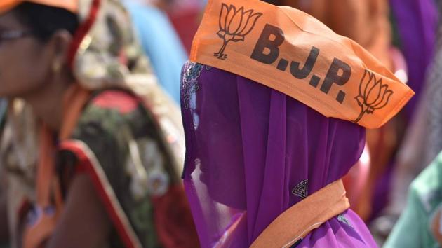 A large number of women voters too thronged the rally venue to express their support to BJP (Arun Sharma/HT PHOTO)