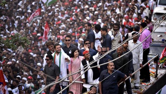 Varanasi, India - March 4, 2017: UP chief minister Akhilesh Yadav, his wife Dimple, and Congress vice-president Rahul Gandhi during their roadshow in Varanasi on March 4, 2017.(Arun Sharma/HT PHOTO)