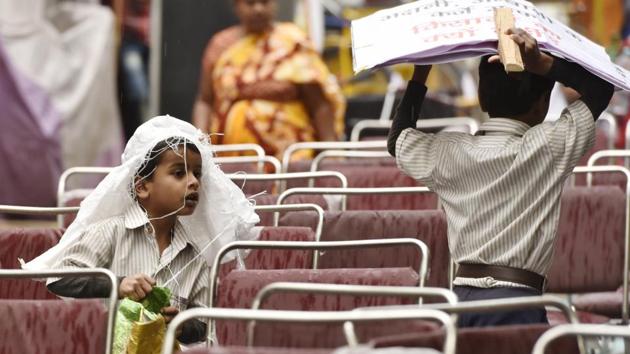 The rain has brought down mercury compelling people to wear woollens, which they had packed after February. (Saumya Khandelwal/HT PHOTO)