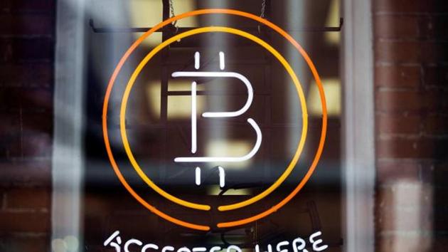 A Bitcoin sign is seen in a window in Toronto (Reuters) A Bitcoin sign is seen in a window in Toronto (Reuters)