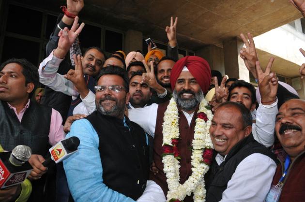 Pargat Singh celebrating his victory in Jalandhar.(Pardeep Pandit/HT)