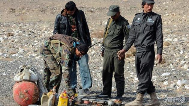 Eight local policemen were killed by their colleagues after they were poisoned in their base in southern Afghanistan, officials said Saturday, in a latest so-called “insider attack”. (AFP File Photo) Eight local policemen were killed by their colleagues after they were poisoned in their base in southern Afghanistan, officials said Saturday, in a latest so-called “insider attack”. (AFP File Photo)