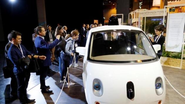 Visitors look at a self-driving car by Google displayed at the Viva Technology event in Paris, France (Reuters photo) Visitors look at a self-driving car by Google displayed at the Viva Technology event in Paris, France (Reuters photo)
