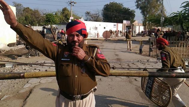 Security outside a counting centre in Punjab’s Fazilka on Saturday. (Anil Dayal/ht)
