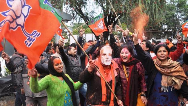 BJP workers celebrate their win in Uttarakhand.(HT Photo)