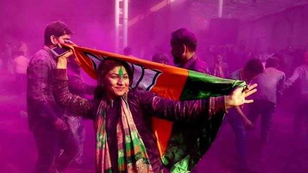 BJP supporters and workers play holi as they celebrate the party’s victory in the UP and Uttarakhand assembly elections in New Delhi, March 11 (PTI) BJP supporters and workers play holi as they celebrate the party’s victory in the UP and Uttarakhand assembly elections in New Delhi, March 11 (PTI)