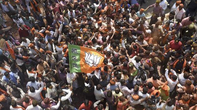 BJP Workers celebrates victory after election results at party office in Lucknow. (Arvind Yadav/HT PHOTO)