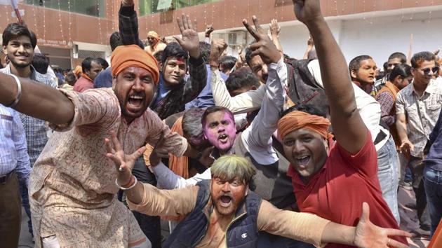 Celebrations by BJP workers at the party office in Lucknow. (Arvind Yadav/HT PHOTO)