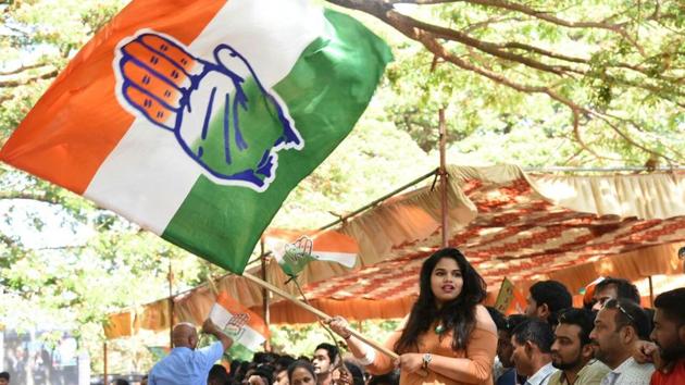 Congress workers wave flags in Panjim. The party has taken a lead in the state elections vote counting in Goa. (HT Photo)