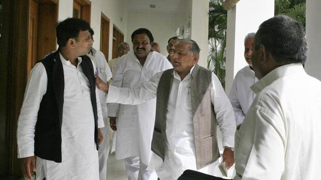 Samajwadi Party Leader Mulayam Singh Yadav with his son Akhilesh Yadav after election result in Lucknow in 2012. (HT Photo)