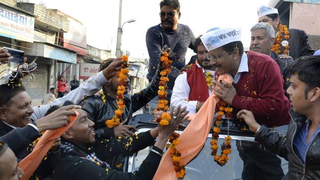 Aam Admi Party chief Arvind Kejriwal at a road show ahead of the February 4 Punjab assembly elections in Jalandhar.(AFP file photo)