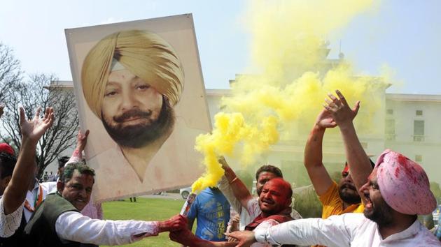 Congress Party workers in a jubilant mood after the party won the punjab assembly elections in Patiala. (bharat bhushan/ht photo) Congress Party workers in a jubilant mood after the party won the punjab assembly elections in Patiala. (bharat bhushan/ht photo)