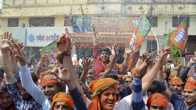 BJP workers celebrate victory at party office in Varanasi. (Adarsh Gupta/ht Photo)