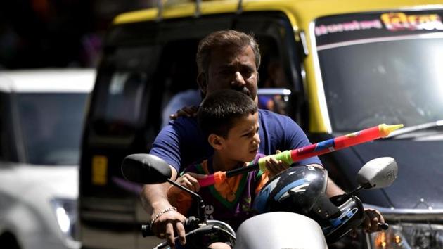 A child plays with a water gun at Parel on Saturday.(HT Photo)