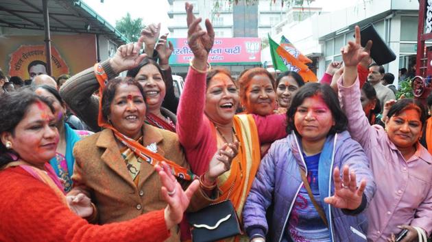 Women celebrate the BJP’s victory in Dehradun. (HT Photo) Women celebrate the BJP’s victory in Dehradun. (HT Photo)