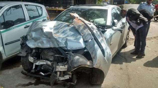 Four people were injured when this BMW car hit an autorickshaw in RK Puram, South Delhi.(Sonu Mehta/ HT Photo)