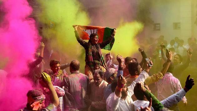 BJP workers play Holi as they celebrate party’s victory in the UP and Uttarakhand assembly elections, at the party headquarters in New Delhi. (PTI Photo) BJP workers play Holi as they celebrate party’s victory in the UP and Uttarakhand assembly elections, at the party headquarters in New Delhi. (PTI Photo)