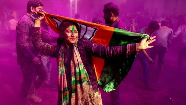 BJP supporters and workers play Holi as they celebrate the party’s victory in the UP and Uttarakhand elections, at the party headquarters in New Delhi. (Manvender Vashist / PTI) BJP supporters and workers play Holi as they celebrate the party’s victory in the UP and Uttarakhand elections, at the party headquarters in New Delhi. (Manvender Vashist / PTI)