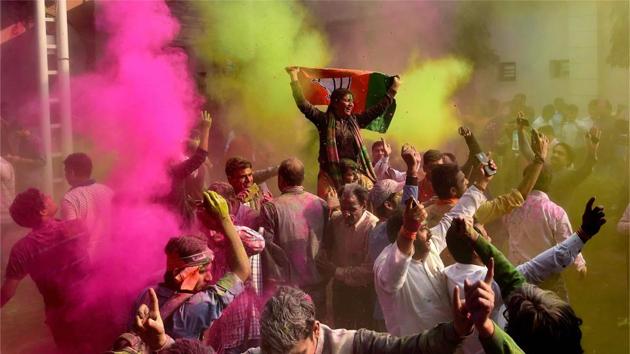 BJP workers play Holi as they celebrate party’s victory in the UP and Uttarakhand assembly elections, at the party headquarters in New Delhi. (PTI Photo) BJP workers play Holi as they celebrate party’s victory in the UP and Uttarakhand assembly elections, at the party headquarters in New Delhi. (PTI Photo)