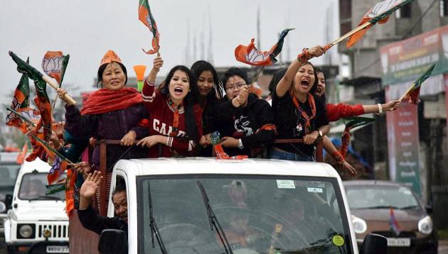 BJP supporters celebrate the victory of their candidate in Imphal.(PTI photo)